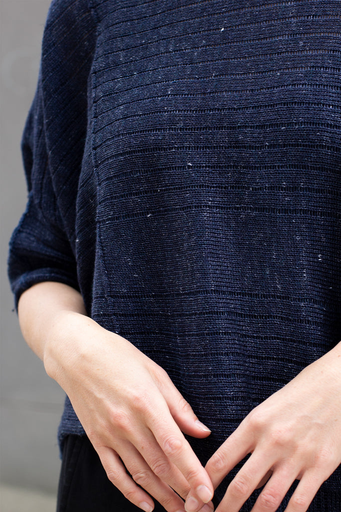 Fabric view of tulip shaped top in dark denim flecked linen and merino wool blend, designed by Wendy Voon.