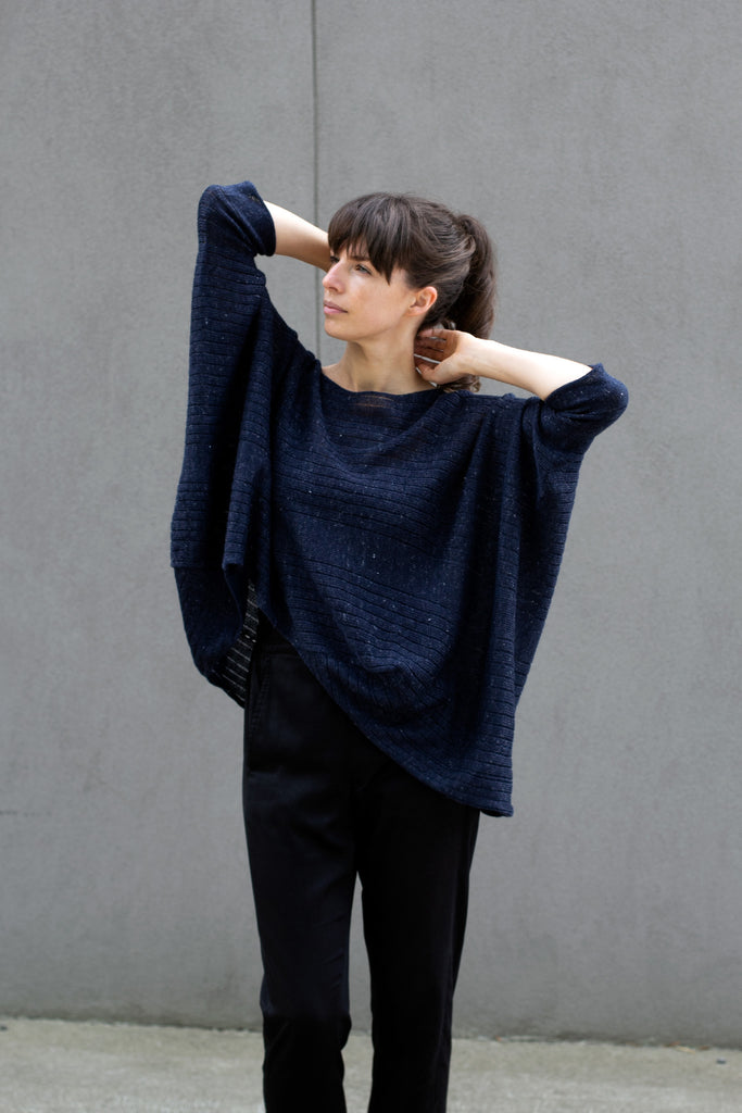 Front view of tulip shaped top in dark denim flecked linen and merino wool blend, designed by Wendy Voon.