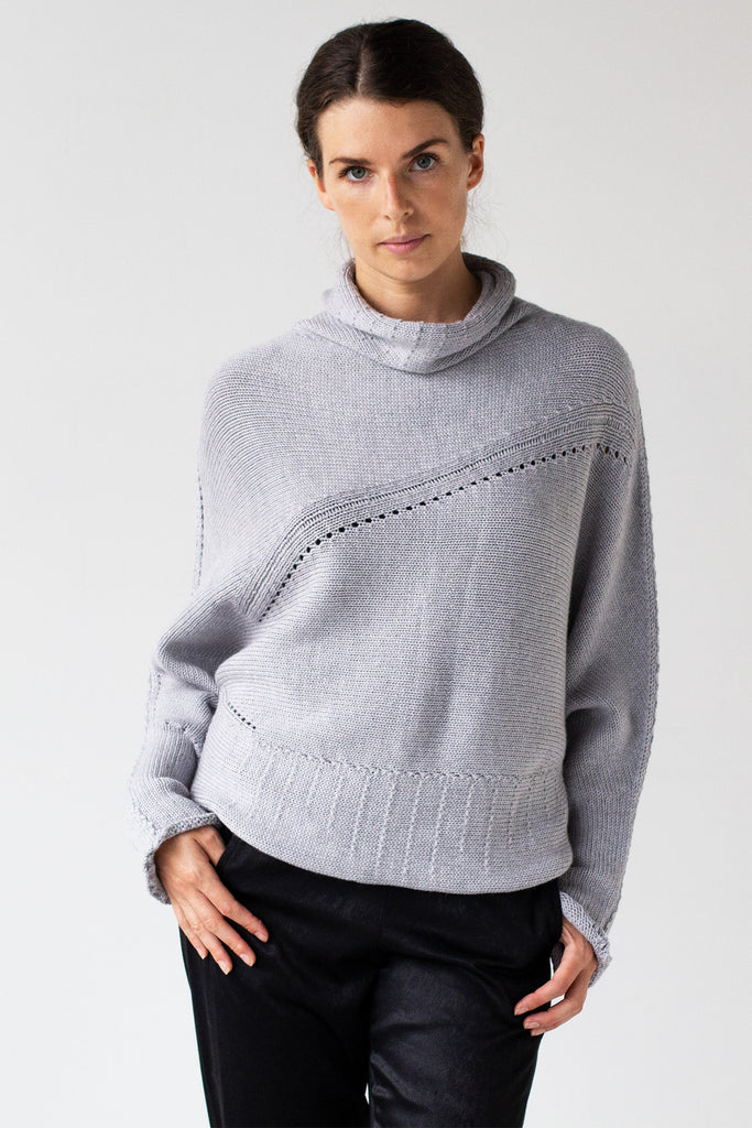 Front view of Chunky Funnel Neck Batwing jumper design by Wendy Voon knits in silver grey merino wool 