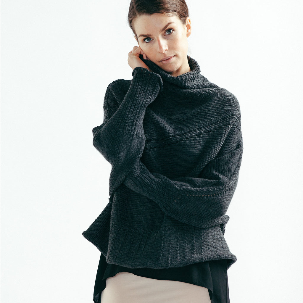 Front view of Chunky Funnel Neck Batwing jumper design by Wendy Voon knits in charcoal merino wool 