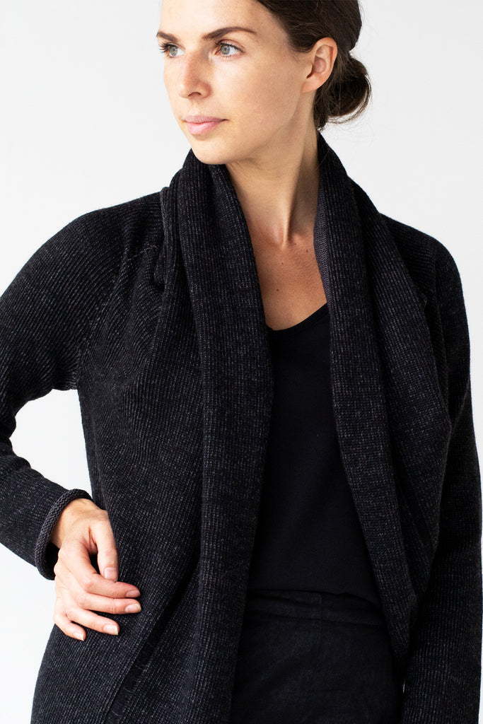 Front detail view of the Merino Cross Over design by Wendy Voon in charcoal and black fleck showing open front neckline