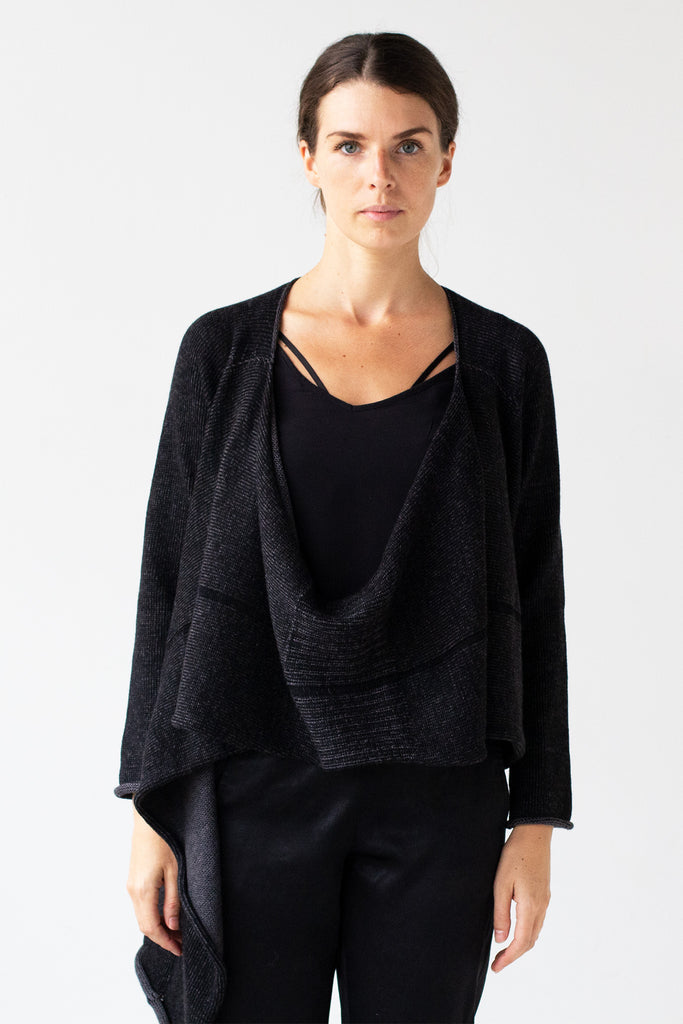 Front detail view of the Merino Cross Over design by Wendy Voon in charcoal and black fleck worn open with front drape