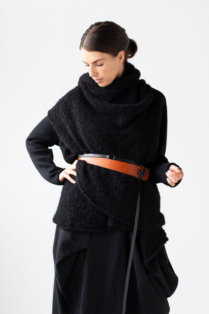 Front view of Logical Progression Coat in black merino and alpaca, worn short, belted at waist and collar worn scarf style