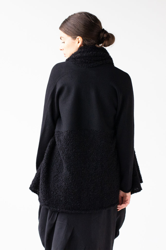 Back view of Logical Progression Coat by Wendy Voon in black merino and alpaca, worn short with straight waist seam
