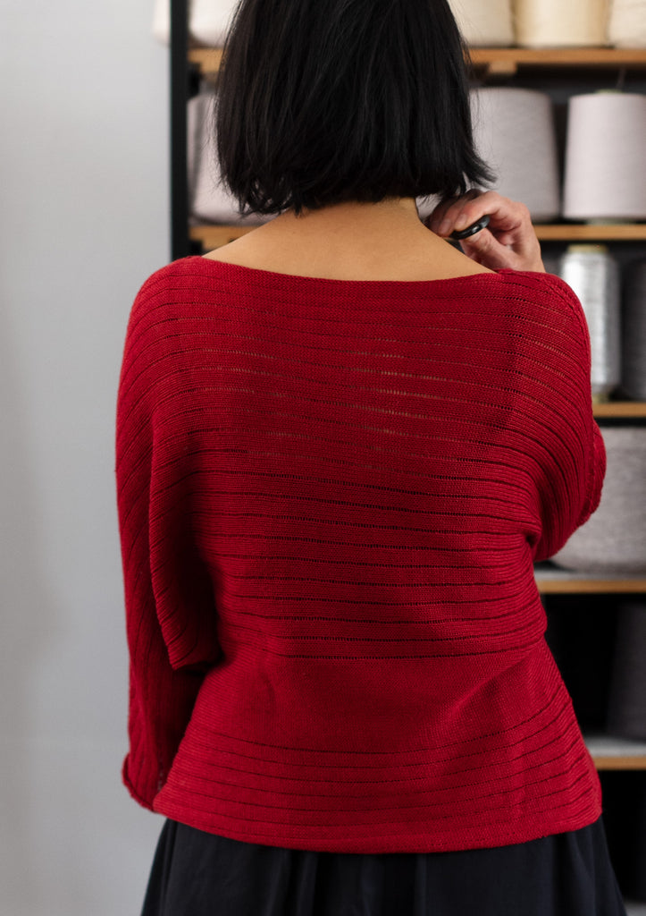 Back view of raspberry coloured linen/cotton knitted batwing, designed by Wendy Voon and knitted in Melbourne.