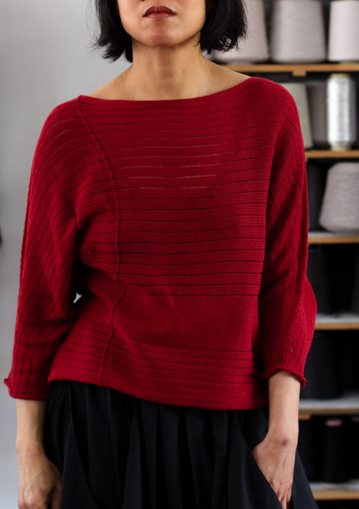 Front view of raspberry coloured linen/cotton knitted batwing, designed by Wendy Voon and knitted in Melbourne.