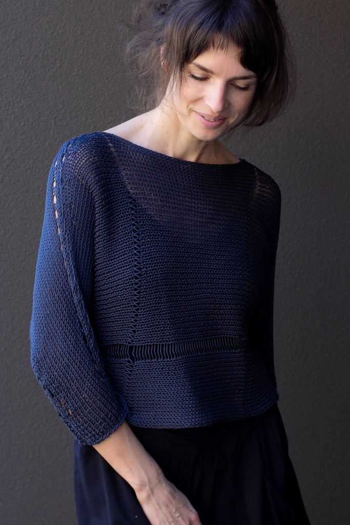 Front view of Cotton Batwing  in slate colourway, featuring large stitch details,  designed by Wendy Voon knits.