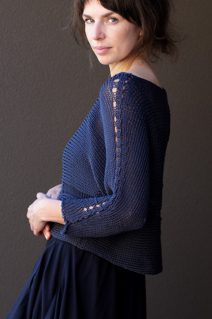 Side view of Cotton Batwing  in slate colourway, featuring large stitch details,  designed by Wendy Voon knits.