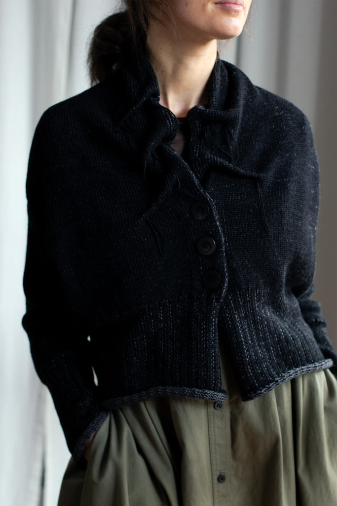 Front view of black flecked chunky knit cardigan, with ruched detail around neck, designed and made by Wendy Voon knits