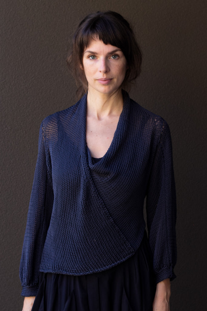 Front profile of model wearing slate cotton cowl neck jumper, designed  and knitted in Melbourne by Wendy Voon knits