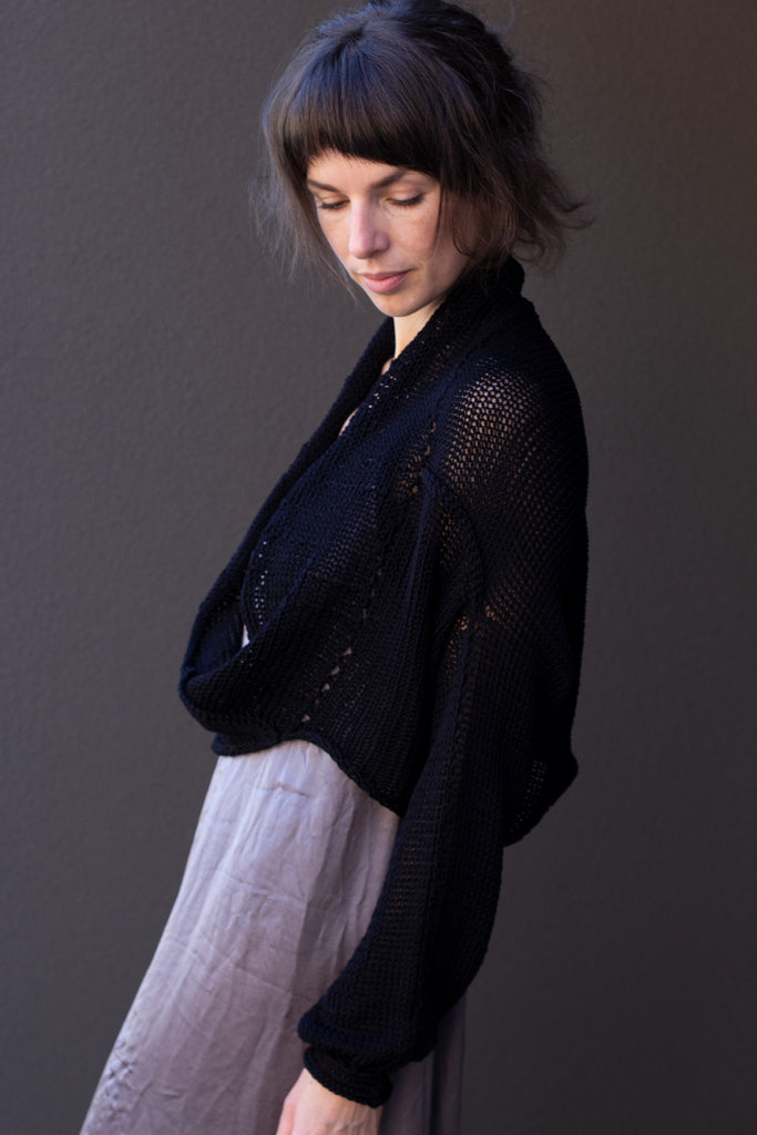 Side view of cotton cropped jumper in black colour way, worn with shawl collar, designed and made in Melbourne by Wendy Voon