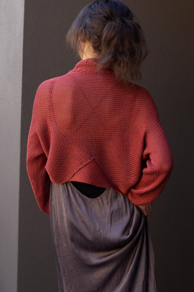 Back view of cotton cropped jumper in coral colourway, worn with shawl collar, designed and made in Melbourne by Wendy Voon