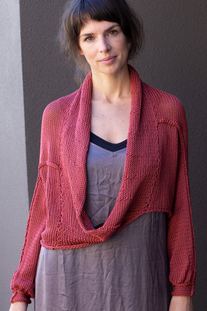 Front view of cotton cropped jumper in coral colourway, worn with shawl collar, designed and made in Melbourne by Wendy Voon