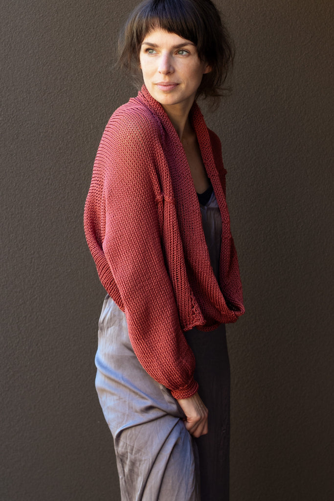 Side view of cotton cropped jumper in coral colourway, worn with shawl collar, designed and made in Melbourne by Wendy Voon
