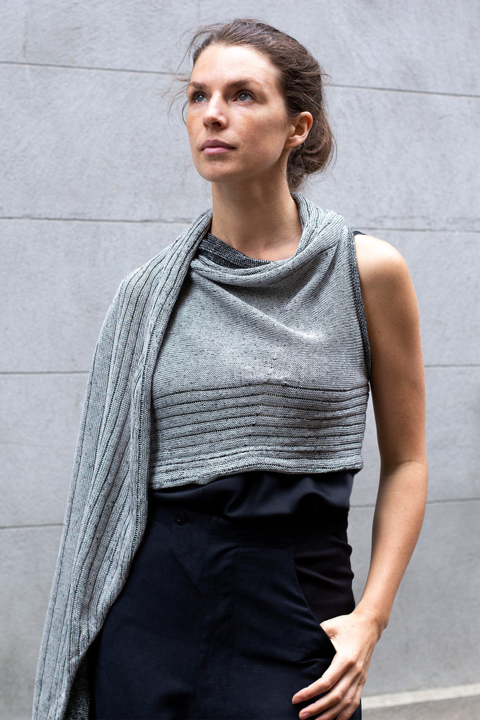 Front view of Multi-Wrap in Linen by Wendy Voon in silver linen with black reverse, worn as cropped shawl style wrap