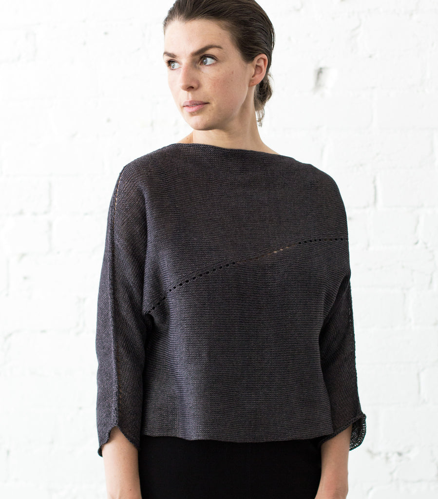 Front view of Linen Batwing jumper design by Wendy Voon knits in charred eggplant linen, showing lace eyelet detail 