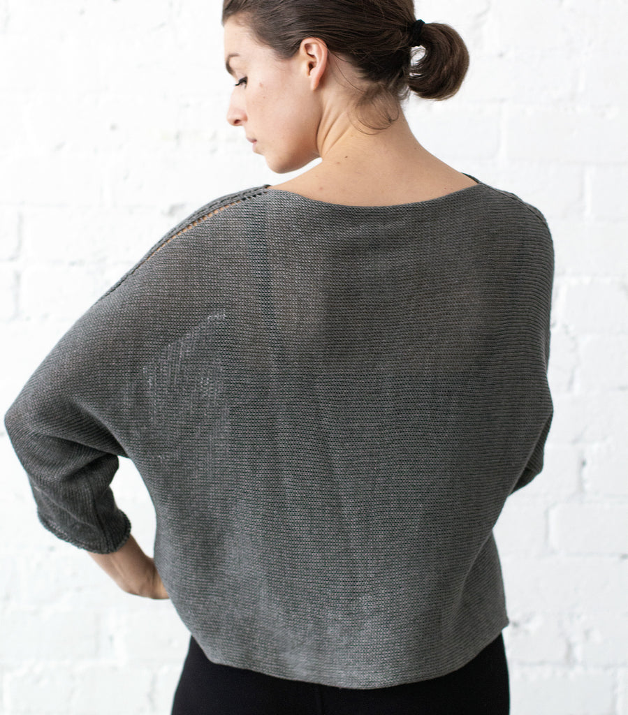 Back view of Linen Batwing jumper design by Wendy Voon knits in pewter linen, showing batwing silhouette