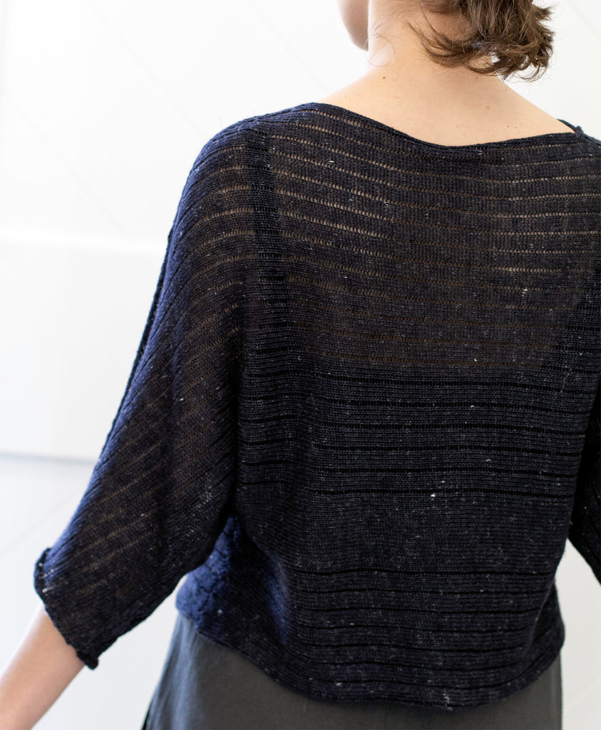 Back view of Linen Laddered Batwing jumper design by Wendy Voon in charcoal flecked linen and merino, shows batwing silhouette