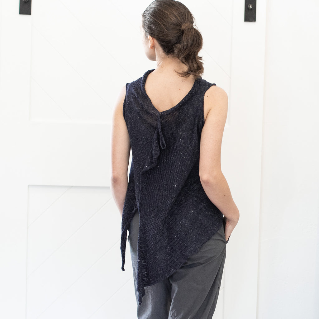 Back view of Linen Laddered Vest design by Wendy Voon knits in charcoal flecked linen, worn back to front