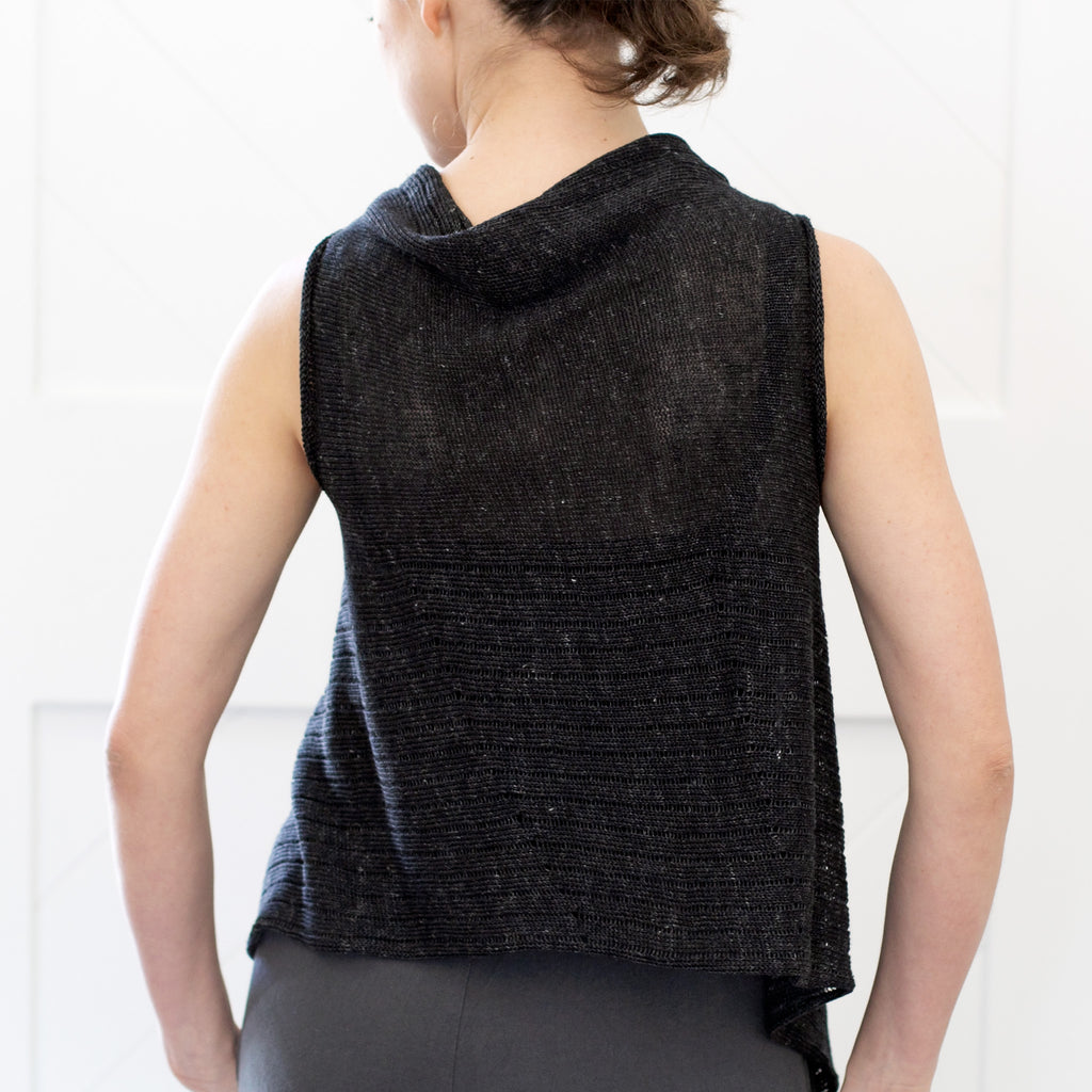 Back view of Linen Laddered Vest design by Wendy Voon knits in charcoal flecked linen, showing laddered fabric design detail