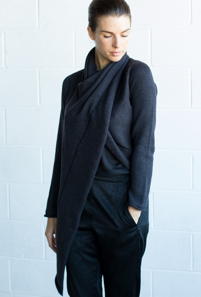 Front detail view of the Merino Cross Over by Wendy Voon in charcoal, worn with front looped as a closed asymmetric cardigan
