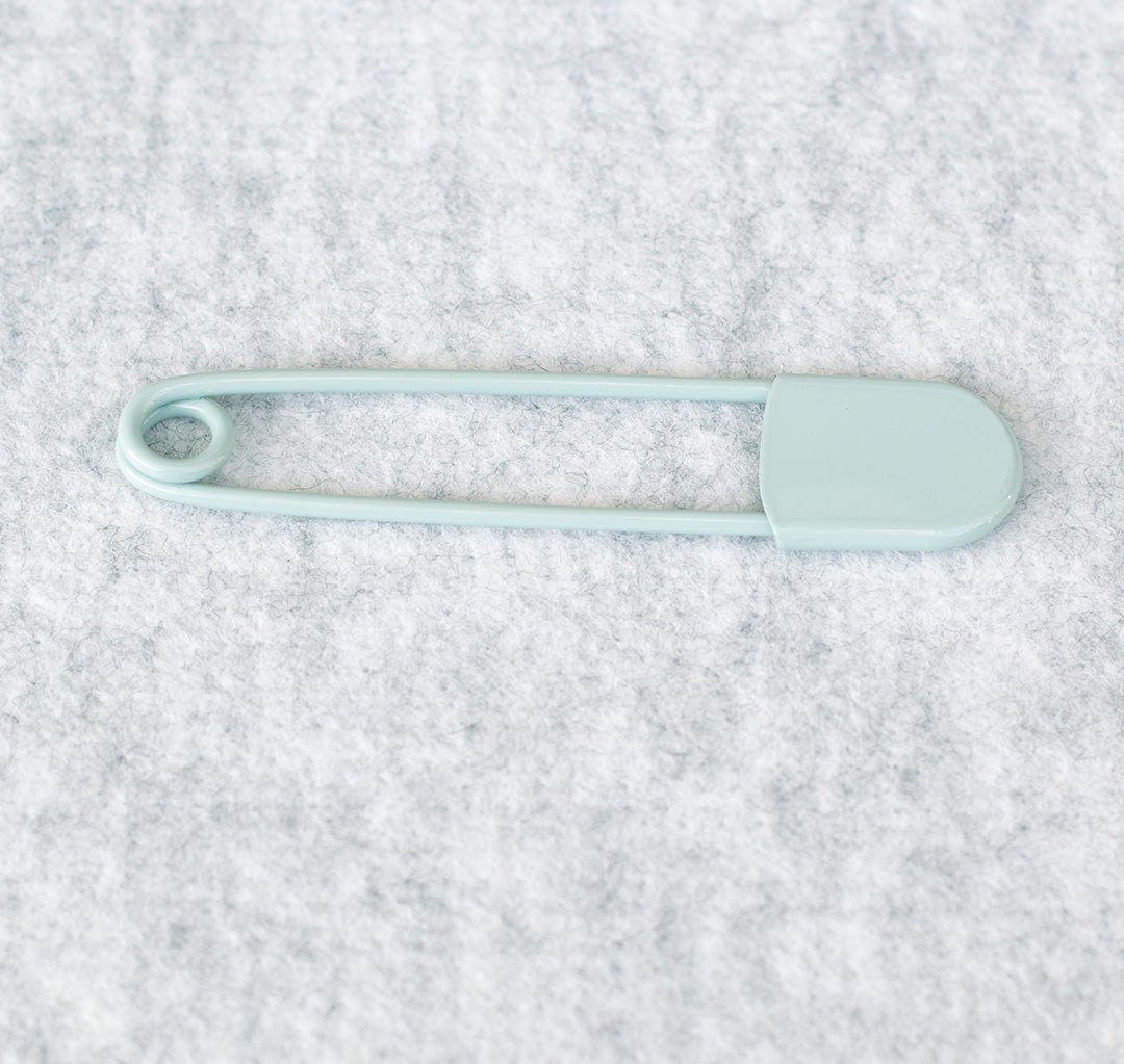 Giant safety pin in duck egg