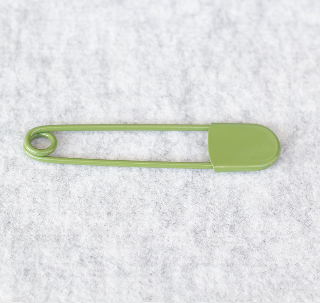 Giant safety pin in moss green