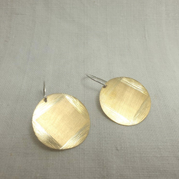 Pair of round dangling earrings, made from gold plated silver with hand etched detail.