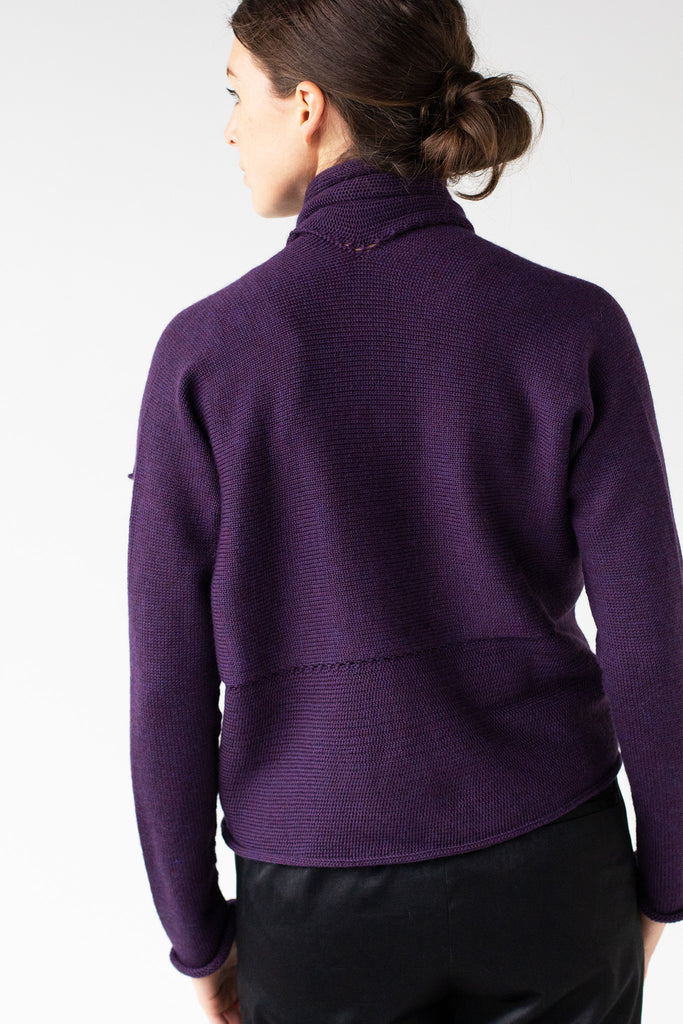 Back view of lum coloured shawl collared cardi made from superfine merino wool, worn upside down, designed by Wendy Voon and made in Melbourne.