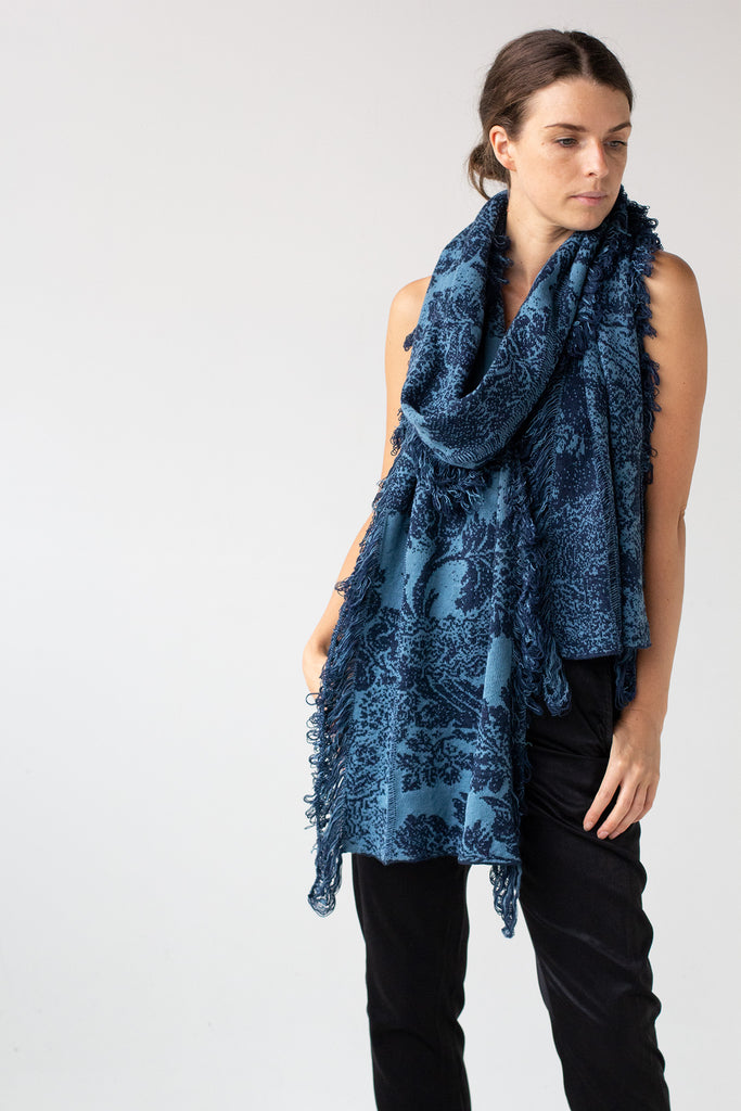 Front silhouette view of deep ocean and lagoon colour Damask Scarf by Wendy Voon knitted in merino wool, linen and cotton