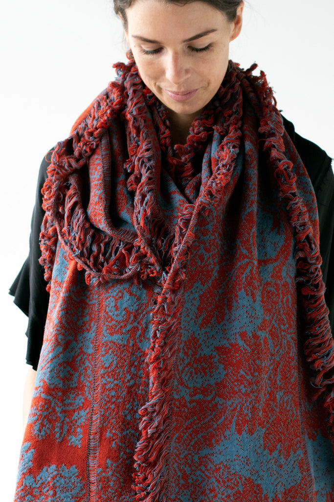 Front detail view of rust and lagoon colour Damask Scarf in merino wool, linen and cotton