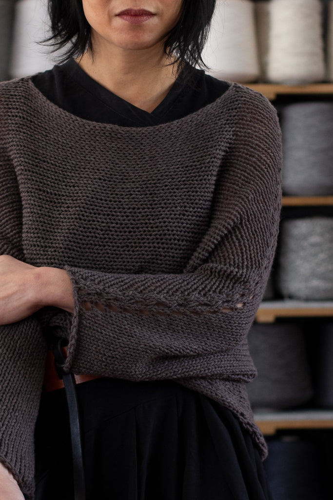 Sleeve detail of loose cord knit batwing in taupe, designed by Wendy Voon knits and made in Melbourne.