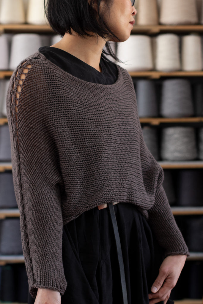 3/4 view of loose cord knit batwing in taupe, designed by Wendy Voon knits and made in Melbourne.
