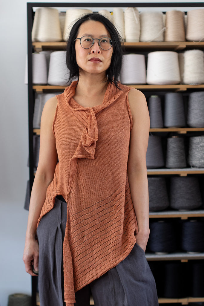 Front view of Linen Laddered Vest design by Wendy Voon knits in linen, showing laddered fabric design detail, in sienna colourway