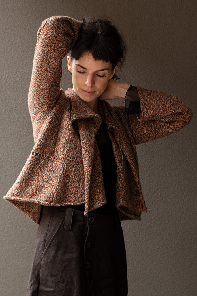 Front view of knitted wool cropped jacket in rust, army and cream melange, designed by Wendy Voon, knitted in Melbourne.