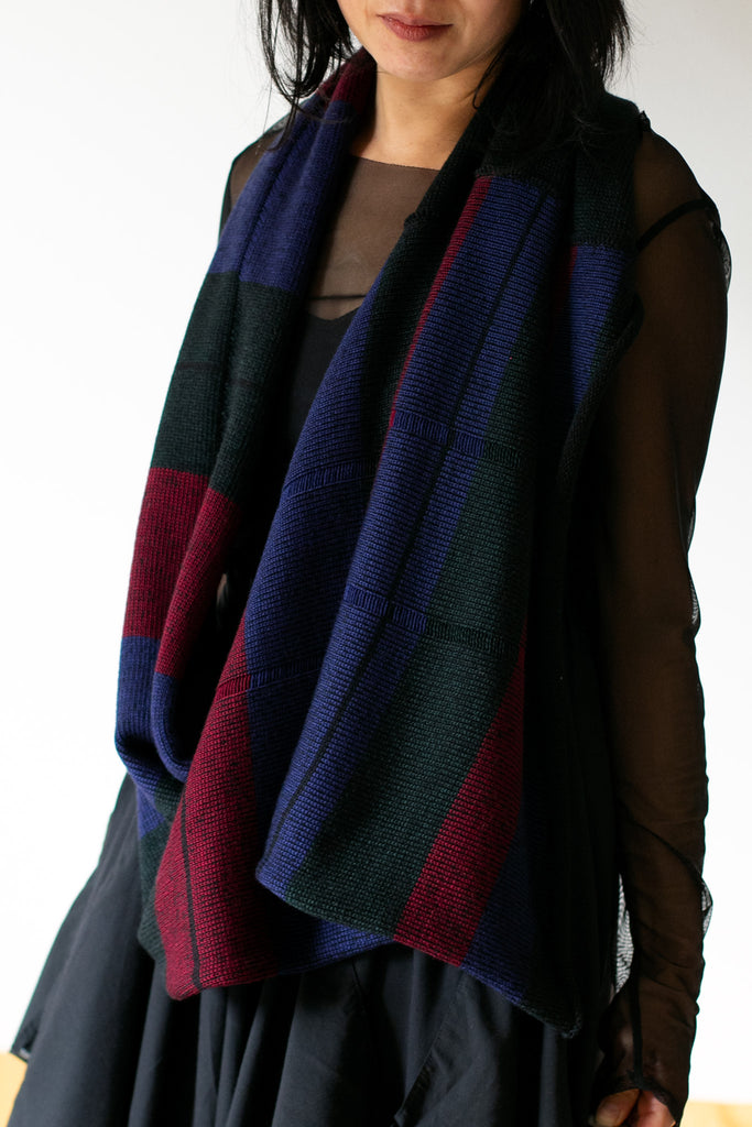 Model wears a multi-coloured infinity scarf, designed by Wendy Voon and made in Melbourne
