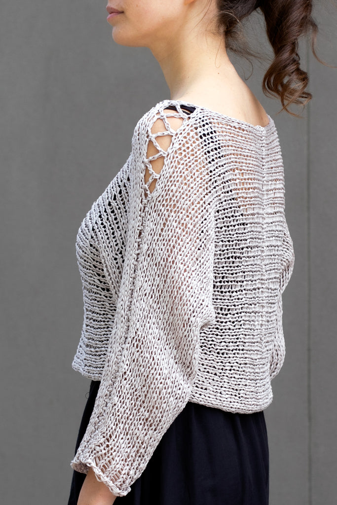 Side view showing sleeve detail  of Large Stitch Batwing jumper, knitted  in Pearl cotton and designed by Wendy Voon