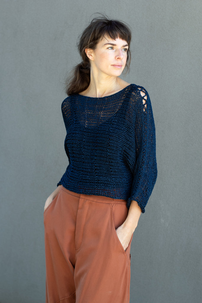 Front view  of Large Stitch Batwing jumper, knitted  in Ocean coloured cotton ribbon yarn, designed by Wendy Voon