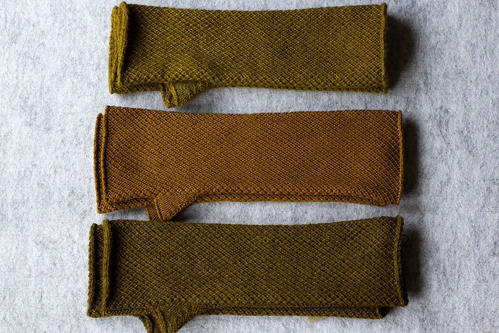 Knitted arm warmers dyed with native cherry in chartreuse colourways