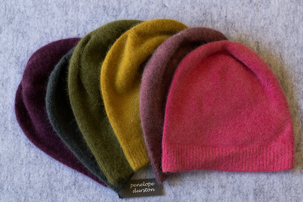 Group of colourful beanies made from angora and lambswool