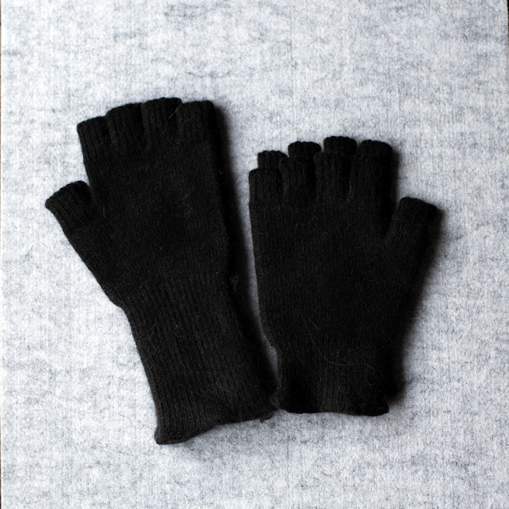 Black coloured fingerless gloves in a merino wool, possum and silk blend